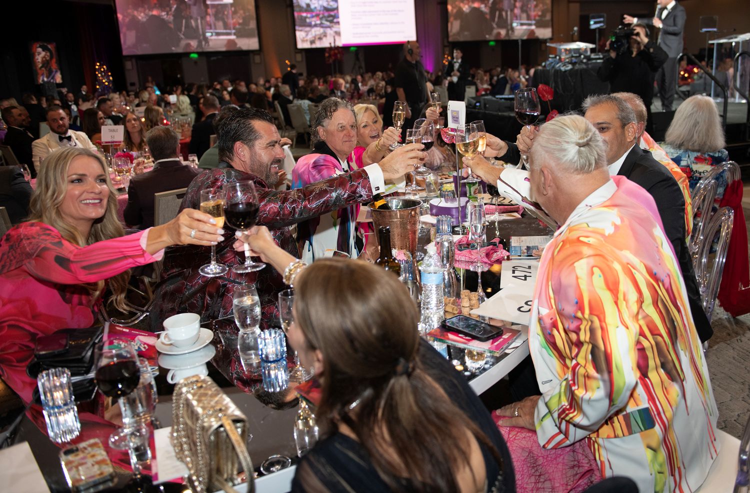 18. Jeff Saplis and guests cheers at specialty table.jpg